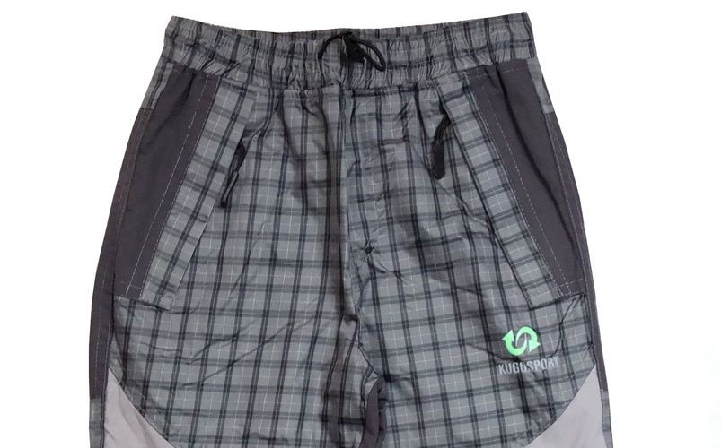 Šusťákové chlapecké kalhoty Kugo